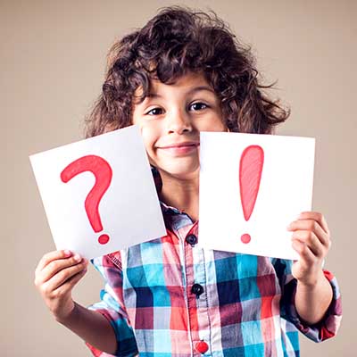 Thinking kid boy with question and exclamation signs